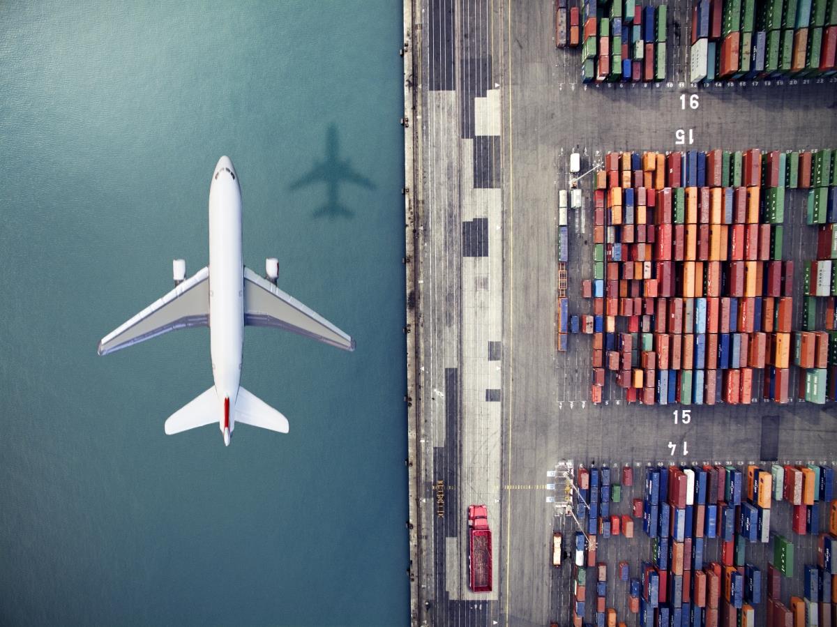 Self Photos / Files - Optimized-Airplane+flying+over+container+port