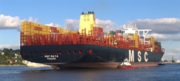 Container_ship_MSC_Maya_with_L_&_R_rear_tractor_prompt_on_the_river_Elbe_with_the_port_of_destination_Hamburg_(cropped)