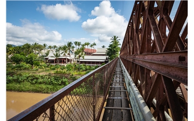 Old Luang Prabang Laos bridge iStock-1190585748