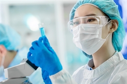 asian scientist in ppe iStock-1184183985