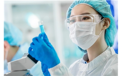 asian scientist in ppe iStock-1184183985