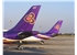 Tails_of_two_Thai_Airways_aircraft_at_VTBD